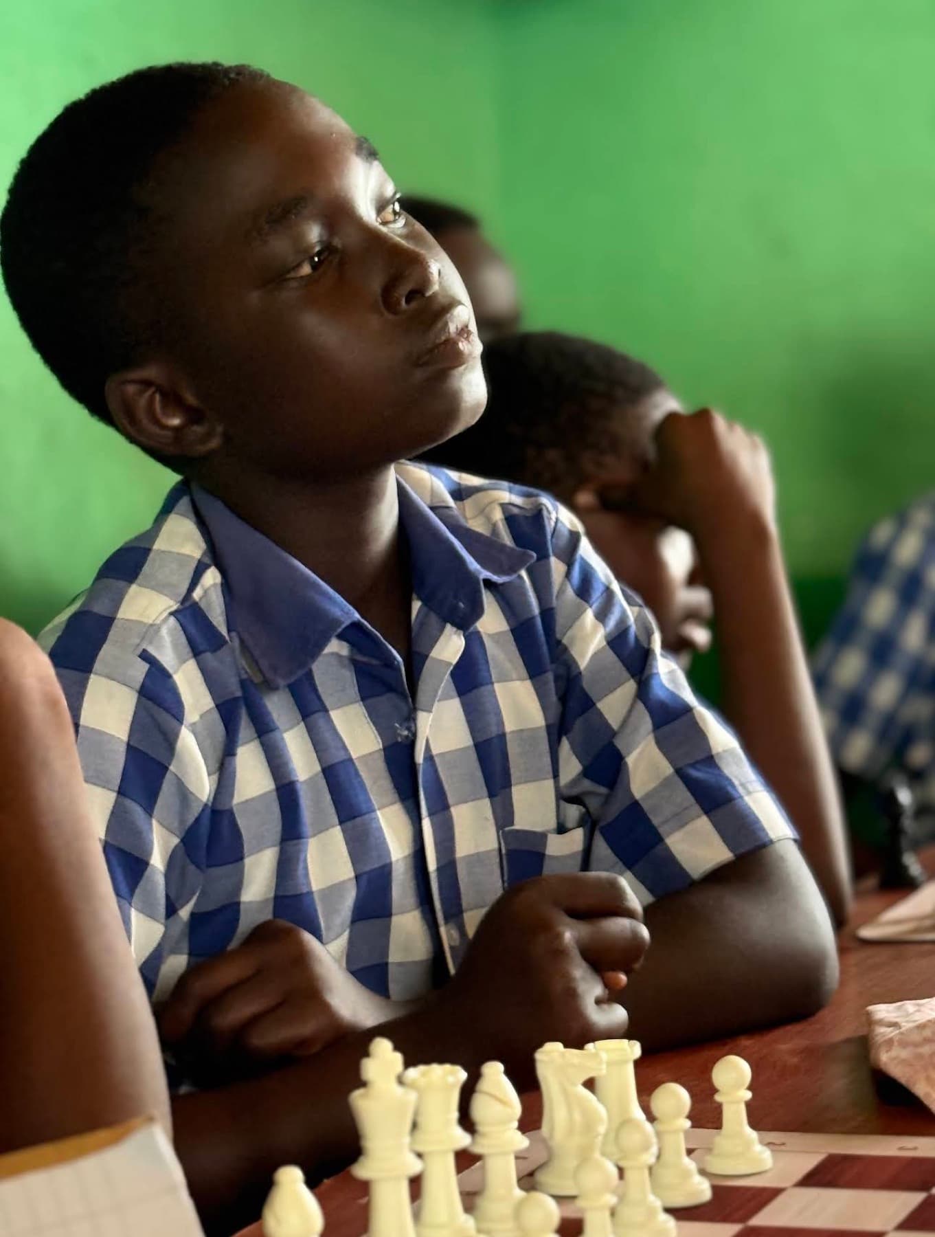 A pupil at the chess board